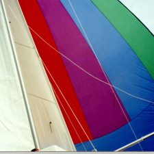 Spinnaker, main and Genoa set on Fretnaught (Photo by Bill Moe)