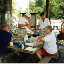 Alex, John, Doug, and Nell fixing breakfast